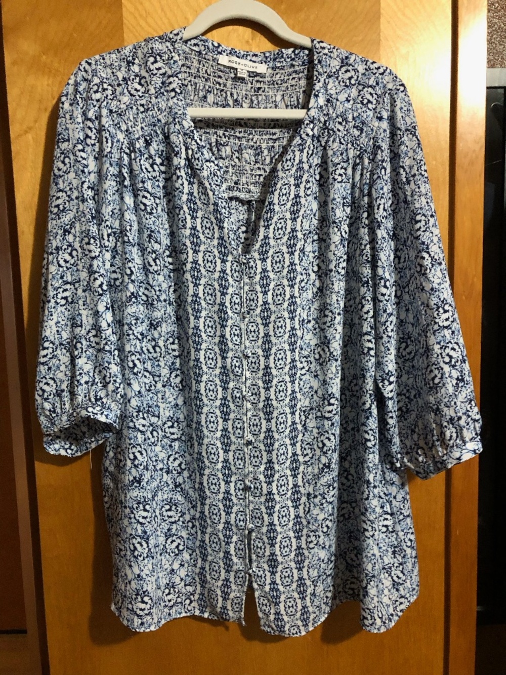 3/4 sleeve button down blue floral blouse by Rose and Olive